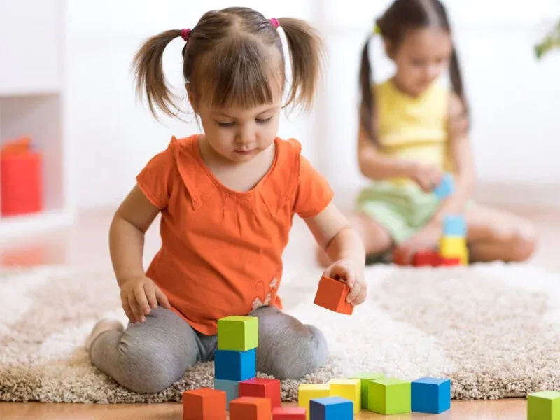 kid playing with toys