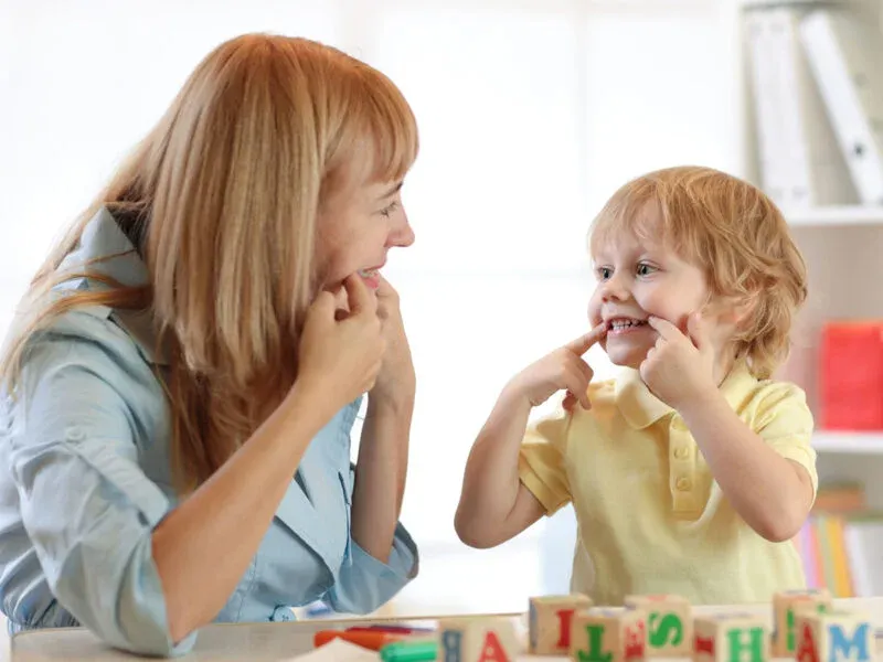 kid playing with toys