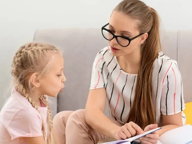 therapist teaching kid