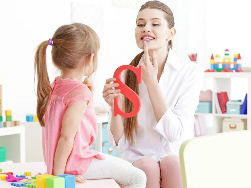 therapist teaching kid